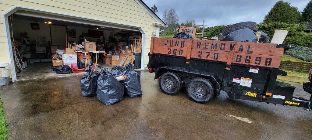 Garcia’s junk removal trailer at a residential cleanout
