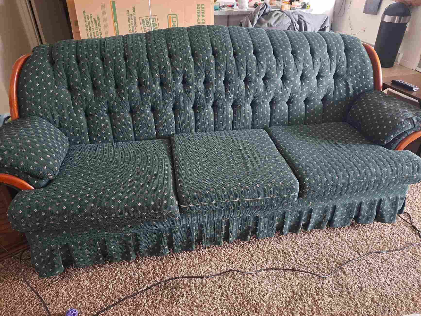 An upholstered sofa ready for furniture removal