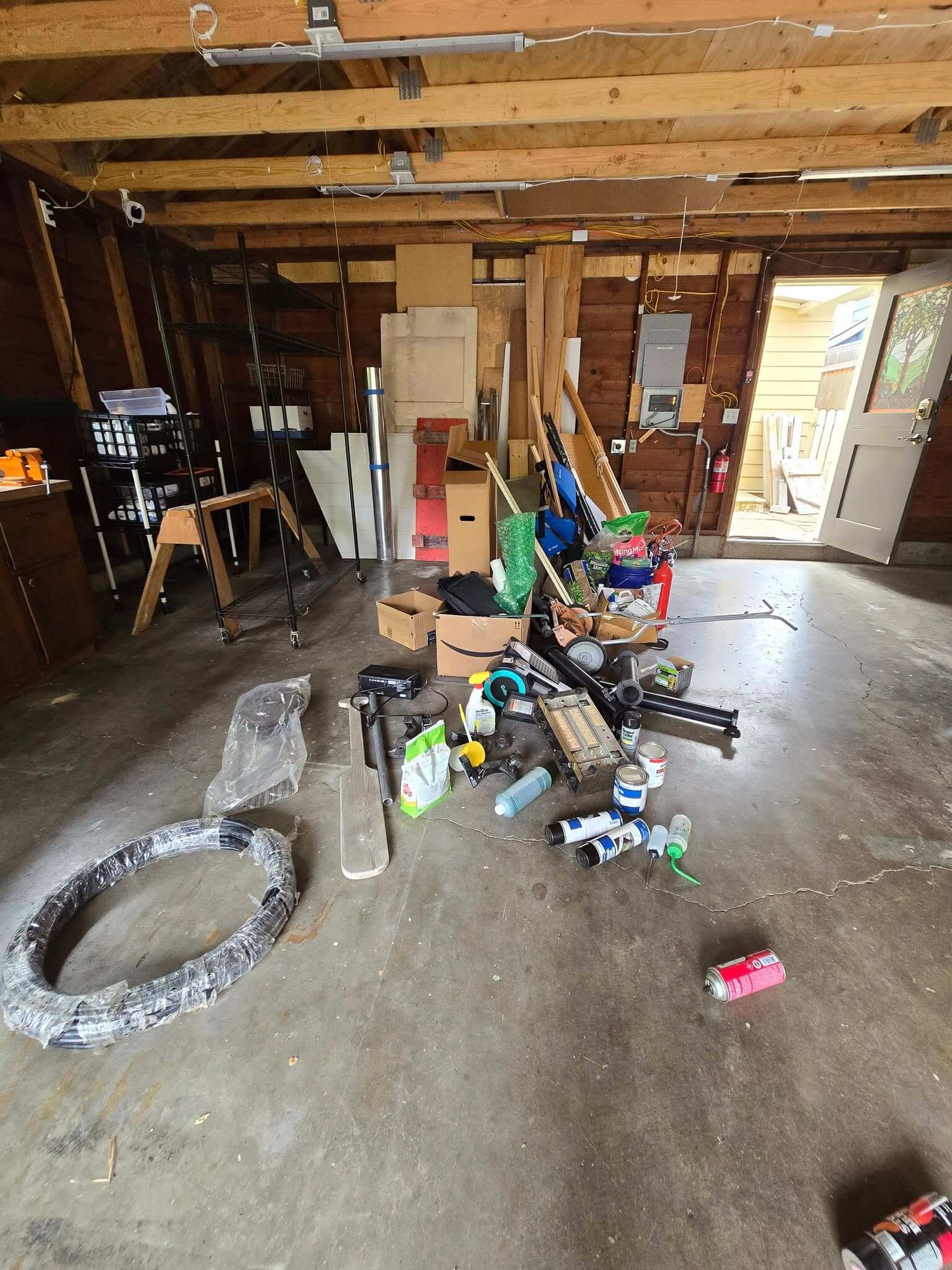 Household items and equipment awaiting a garage cleanout
