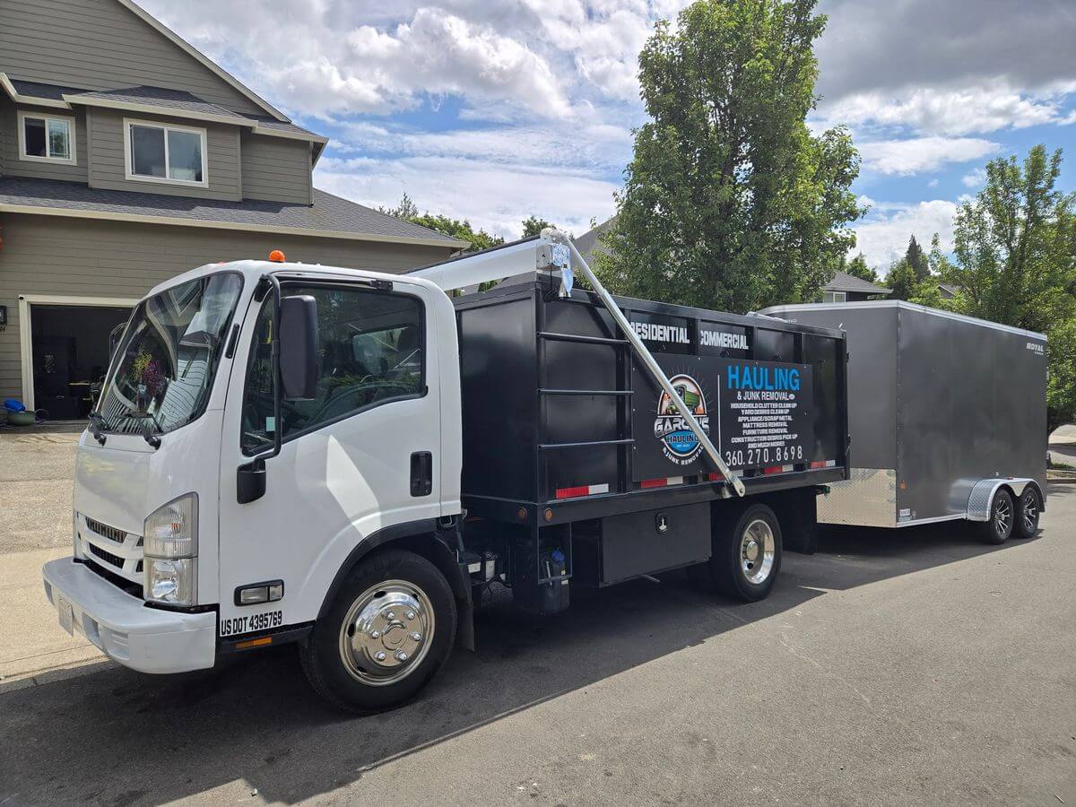 Garcia’s white hauling truck and enclosed trailer outside a Vancouver home